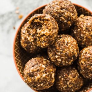 No-bake cinnamon pecan pie bites in a bowl with autumn spices.