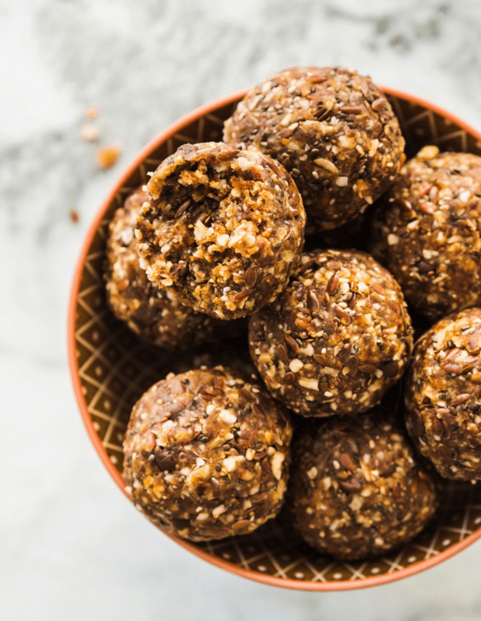 No-bake cinnamon pecan pie bites in a bowl with autumn spices.