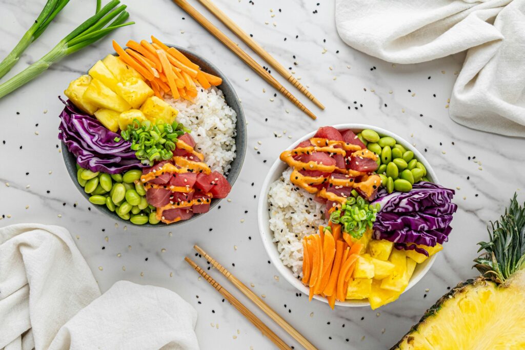 Two bowls filled with colorful plant-based foods, including vegetables, grains, and legumes, representing a healthy plant-based diet for diabetes management.