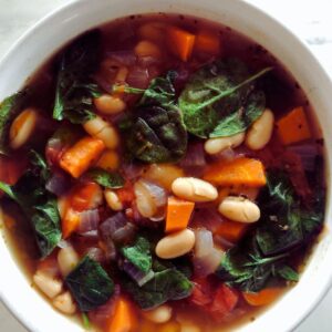 Delicious Tuscan white bean soup with fresh vegetables, hearty white beans, and savory herbs, perfect for a comforting and nutritious meal