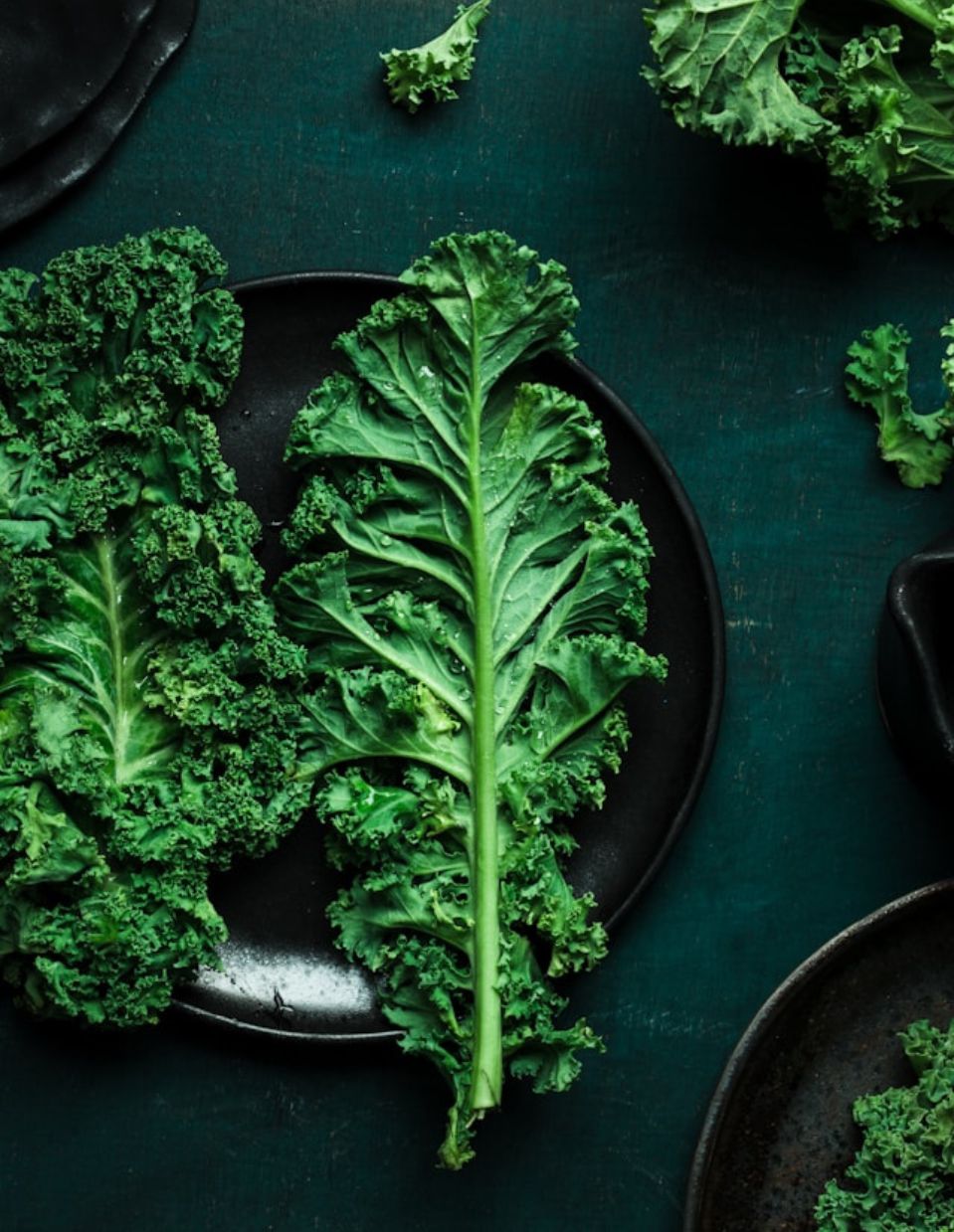 A bunch of fresh, vibrant green kale leaves with curly edges, rich in nutrients and antioxidants for heart health.