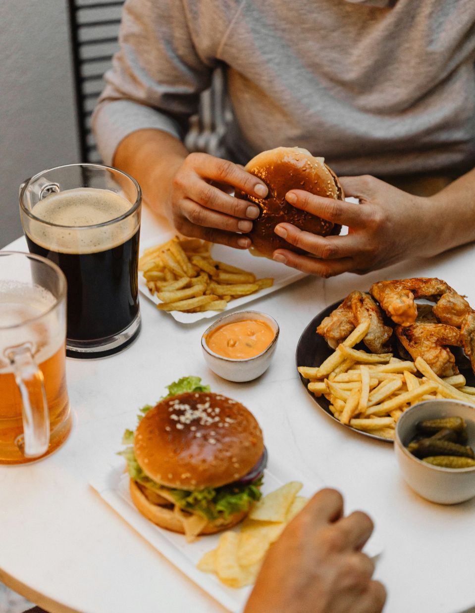 Highly processed foods and alcohol on a table representing foods and drinks that can harm gut health.