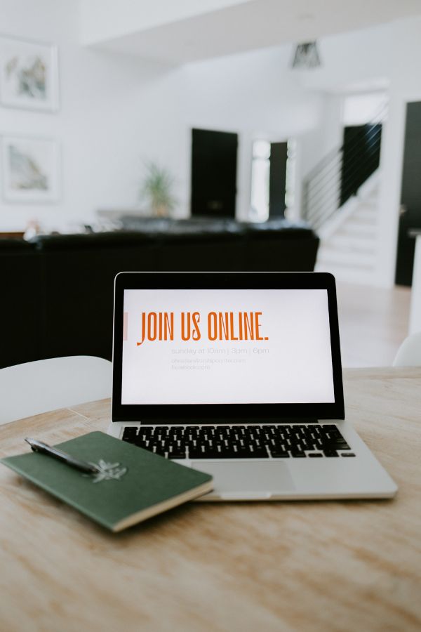 Telehealth dietitian consultation setup with a laptop on a desk displaying 'Join Us Online' for virtual nutrition support